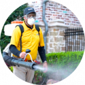 Mosquitonix employee wearing backpack mist blowers